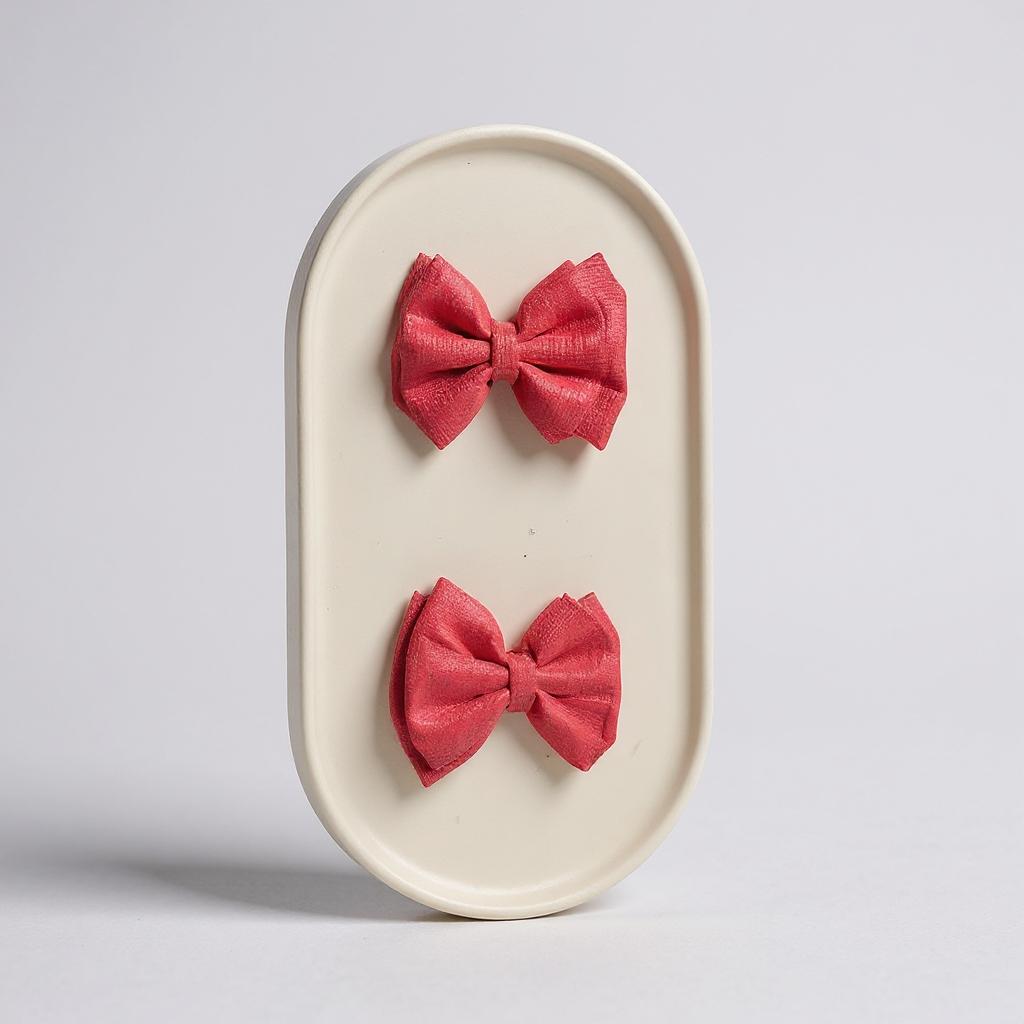 Par de moños chicos coral