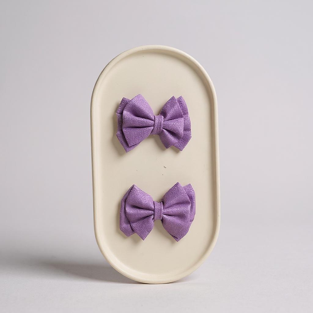Par de moños chicos lila