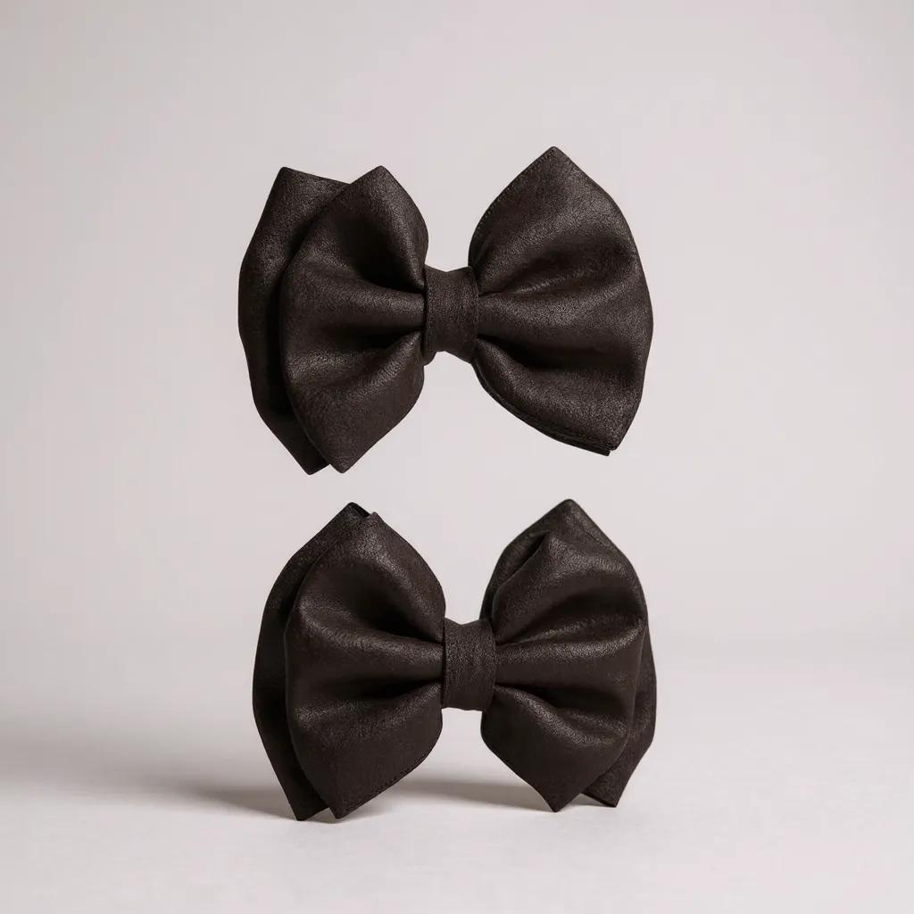 Par de moños chicos negros