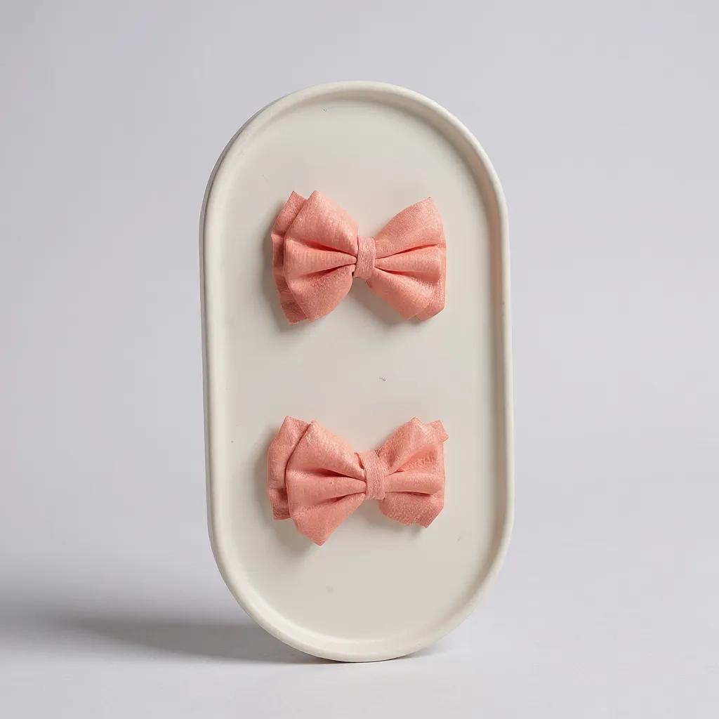 Par de moños chicos melón